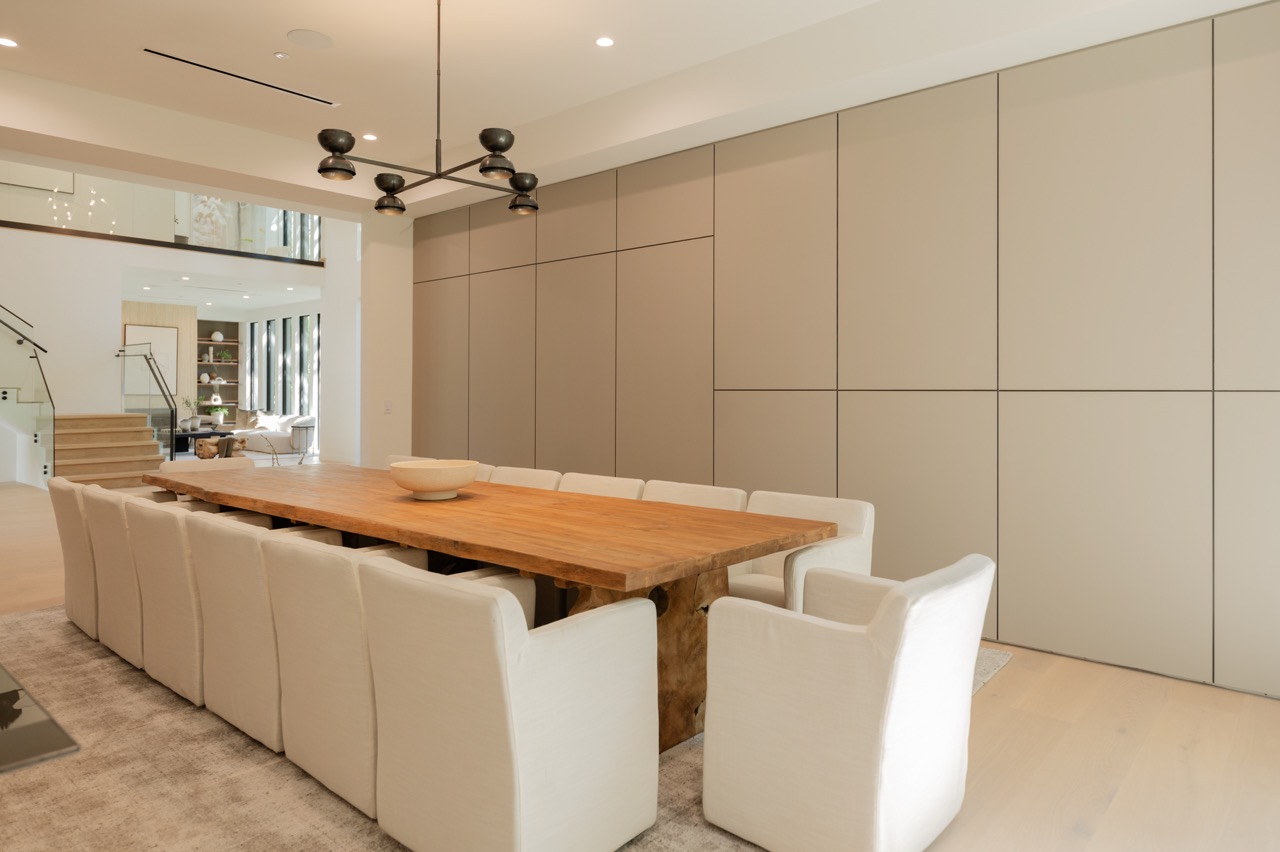 Dining room wall of concealed storage, flush and handleless